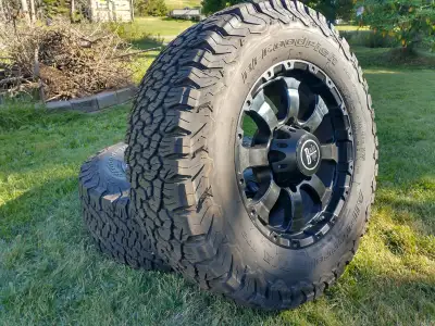 2 Only . Pair of tires and rims for sale. BF Goodrich T285/65R18. Black Iron Rims 18"x8.5" From a 20...