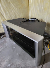 TV stand by SONY. Grey color and glass shelf 