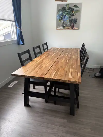 Acacia wood ikea table and 6 chairs, beautiful table and great shape. There is a chew mark from our...