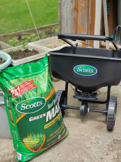 Scott's spreader in new and clean condition. As well as sealed 18.9 kg bag of scotts turf builder gr...