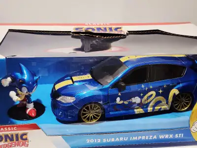 New in box. Jada Hollywood Rides. Classic Sonic The Hedgehog w/figure. Length: 8" inches Pls contact...