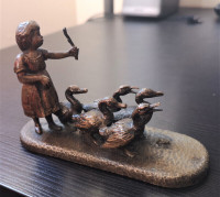 Vintage girl with geese bronze statue