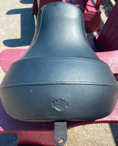 Reduced reach seat for Harley Dyna. Came off 2011. Like new. Only used for 60kms and then sold bike...