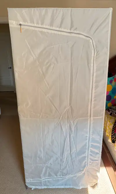 Folding Portable Closet Metal Frame Has a built-in rod for hangers Two shelves at the bottom Two dif...