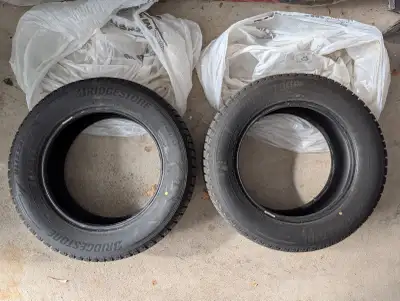 Set of 4 Bridgestone Blizzak winter tires 235/60R17. Made in 2024. Like new condition.