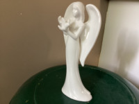 White Angel Holding Bird Statue