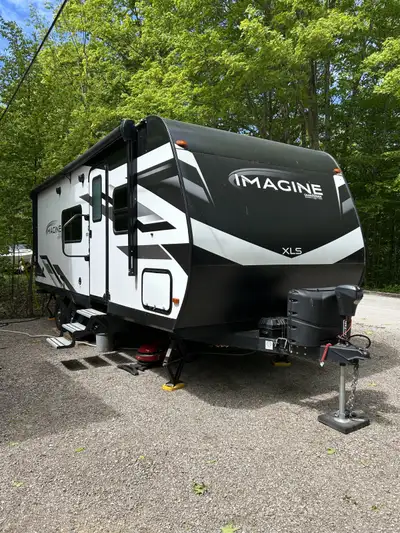 The 2023 Grand Design Imagine XLS 22MLE has a length of approximately 26"1"", sleeps 4, and has a dr...