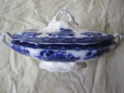 Beautiful flow blue sever dish, made in England. Chip on inside rim, (not noticeable when lid is on)...