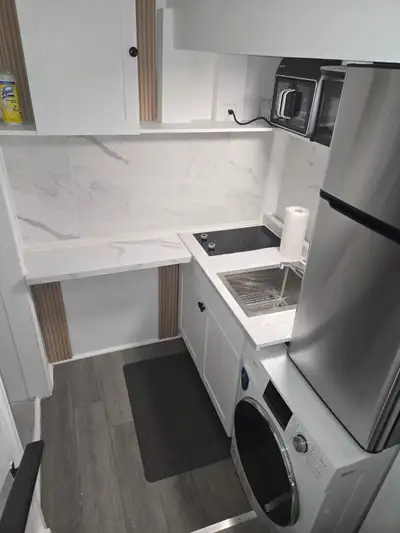 This is a newly renovated basement studio apartment. It comes with a fridge, in unit washer and drye...