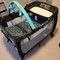 Baby play pen with mattress, bassinet, and changing table