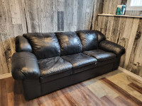 Black leather couch hidabed