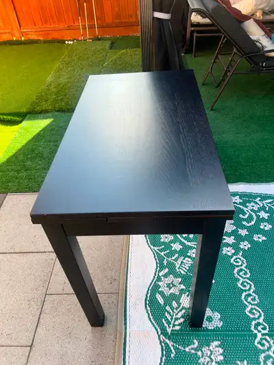 Black-brown extendable dining table is made of wood veneer, View more