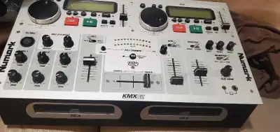 The Numark KMX02 is a used DJ mixer with dual CD players, offering a comprehensive setup for mixing...