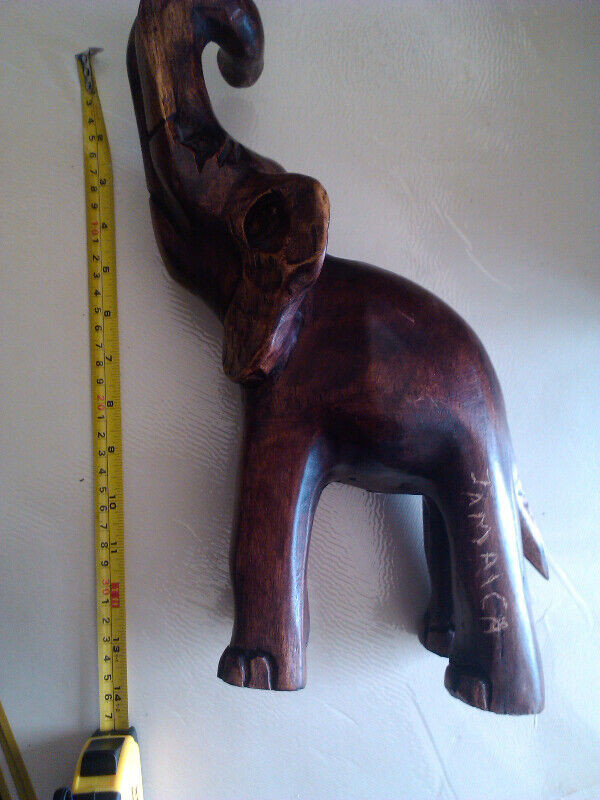 Elephant wood 14 inch tall has Jamaica carved on leg in Home Décor & Accents in City of Toronto