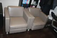 Two leather sofa chairs