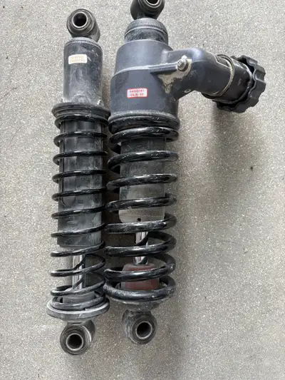 Rear shocks from a 2015 Harley Street glide probably 11 1/2 inches long call 2049557206