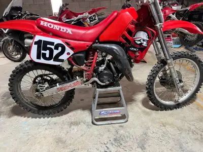 1988 Honda CR 125, less than 30 min on professionally rebuilt engine. Runs great. Spare plastics and...