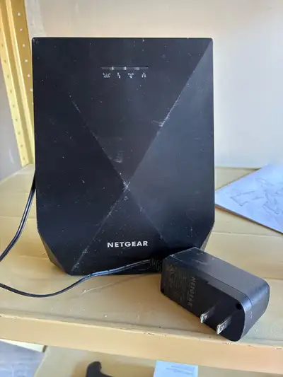 I'm selling a used Netgear WiFi Range Extender, which enhances your existing network's range and spe...