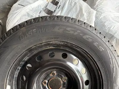 Set of 4 Toyo Observe GSI6 winter tires in size 235/65R17, mounted on steel rims. These tires are in...