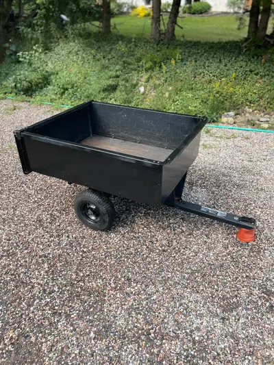 Tow behind lawnmower trailer. Tires hold air. Spare tire included.