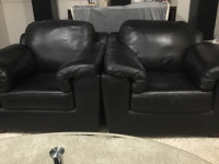 2 black leather chairs