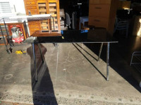 GLASS TOP DINING TABLE OR PROJECT TABLE WITH ADJUSTABLE LEGS.
