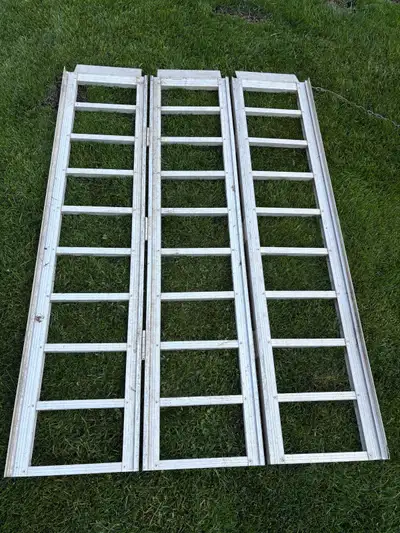 I'm selling an aluminum loading ramp, perfect for various loading needs. The ramp show signs of wear...