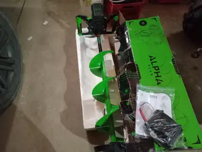 New 10 inch Ice Auger has forward and reverse ,comes with 1 battery and charger may consider trade f...