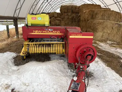 New holland 311 small square baler. Good working condition. New Acid applicator with moisture tester...