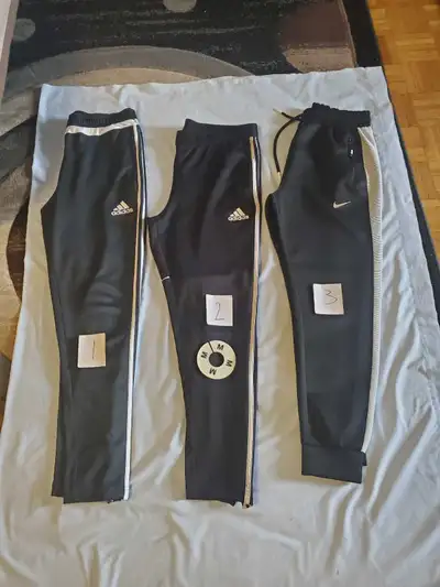 For all 13 pairs $150 only cash. I'm selling a selection of men's and boys' track pants, all in size...