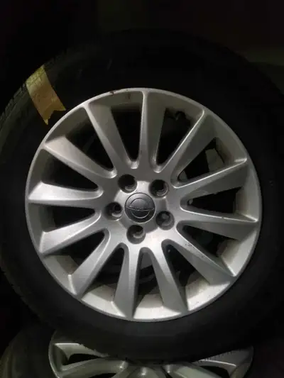 Used - Good $ 1050 cash, pick-up price , per set of 4 rims + all-season tires Call The TIRE BOSS @ 6...