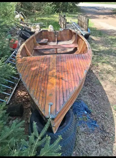 Vintage 1995 cedar strip boat. With seats. Gas cans. 4,000$