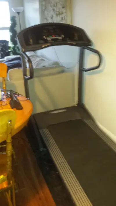 Professional Treadmill folds up and uses castors for easy transport. Shock absorbing orthopedic cush...