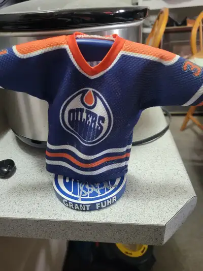 No box. Signed at a game. Grant Fuhr mini jersery that comes with the stand. Text (780) 920-9700 for...
