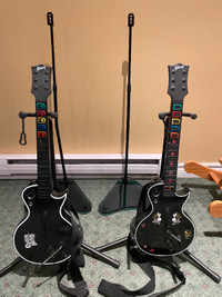 Guitar Hero 2, 3, Gibson Les Paul controllers, and stands