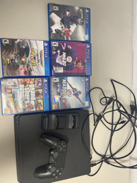 PS4 with games and controller 