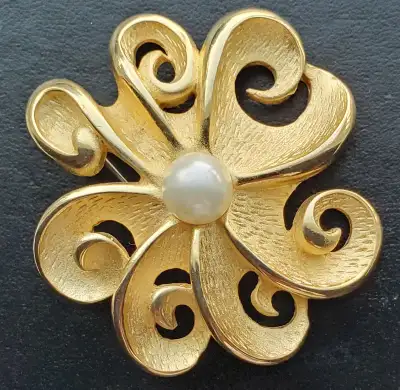 GOLD SWIRL BROOCH WITH A PEARL AT CENTRE, View more