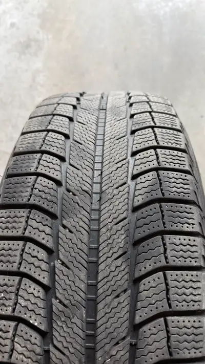 I'm selling a set of four winter tires mounted on alloy rims, size 235/60R18. These tires are Michel...