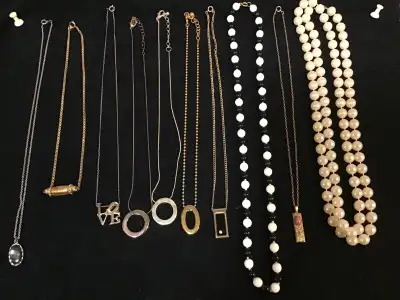 A collection of vintage estate necklaces , View more