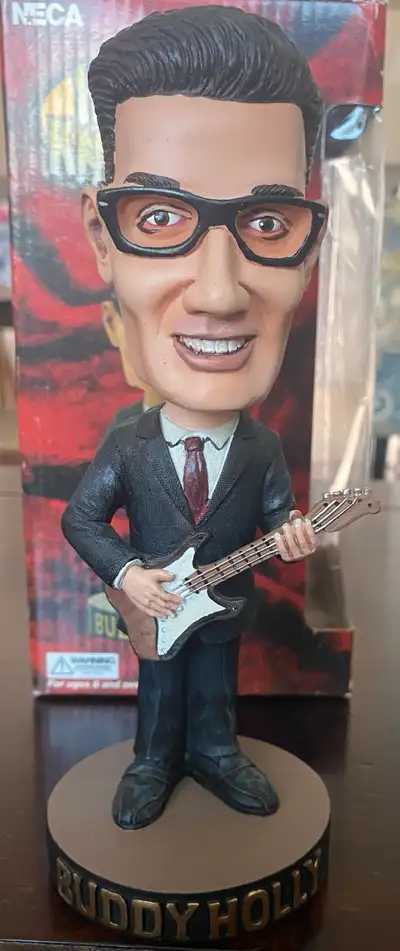 For sale: Authentic NECA Buddy Holly Head Knocker, a rare and retired collectible bobblehead from th...