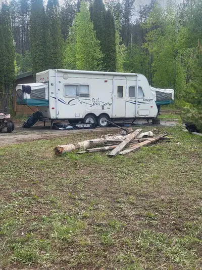 19' hybrid Bobcat trailer when closed. Queen and double bed. Table also folds into a queen bed. Larg...