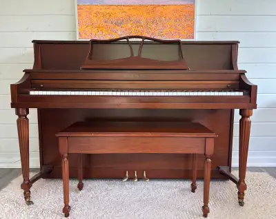 Sherlock Manning upright piano and piano bench with storage. Serial number 236506 Dimensions: -Heigh...