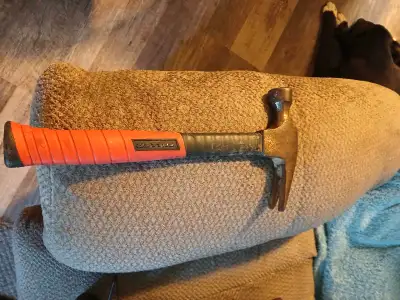 Solid Hammer with rubber grip..." Heavy" (about 20 OZ)