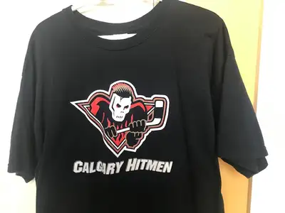 Barely worn Black T-Shirt with logo of Calgary's junior hockey team in very good condition. 100% Cot...