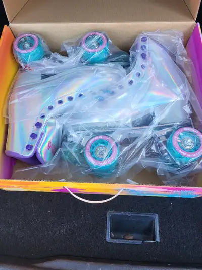 Hi! I am selling a pair of Holographic Roller blades! They are in amazing condition and have never b...