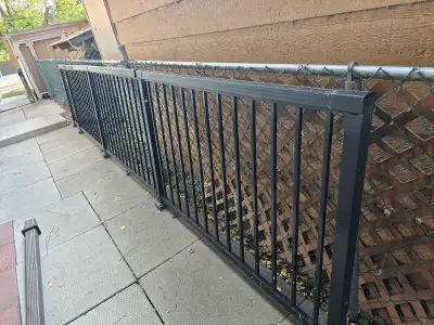 18' of black aluminum railing as seen in pics. Good condition overall, no peeling. Some deck stain o...