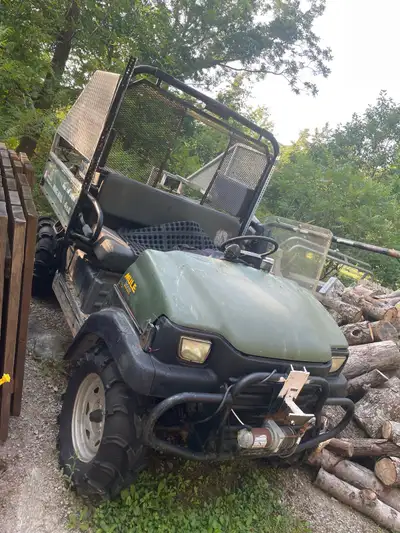 Kawasaki Mule side by side Workhorse with high torque Diesel Runs drives stops Comes with the origin...