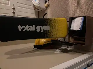 Total Gym - foldable, all attachments and exercise cards in new condition included.