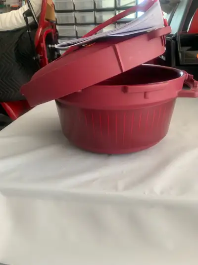 Tupperware microwave pressure cooker. Never used. Complete with manual. Located in Morinville. Cash...