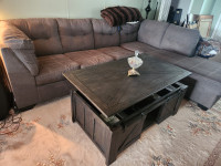 L shaped queen size sofa bed and coffee table.